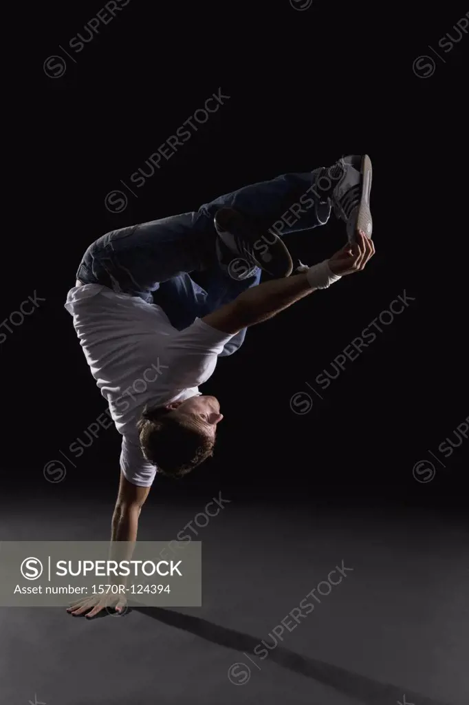 A B-boy doing a  Freeze breakdance move