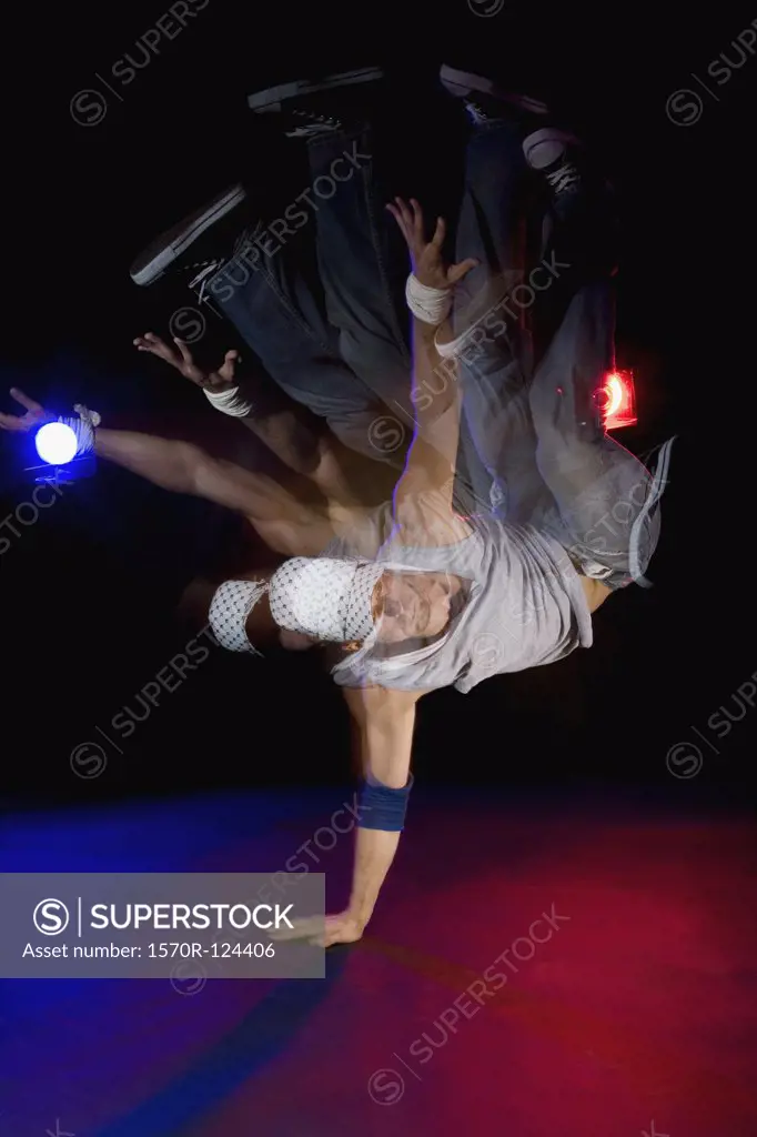 A B-boy doing a Pike Freeze breakdance move