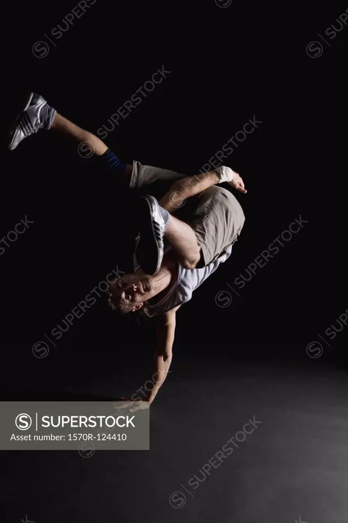 A B-boy doing a One-handed Freeze breakdance move