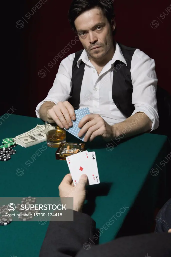 Two men playing poker at a high stakes game