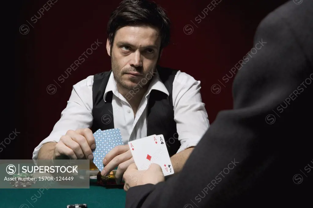 Two men playing poker at a high stakes game