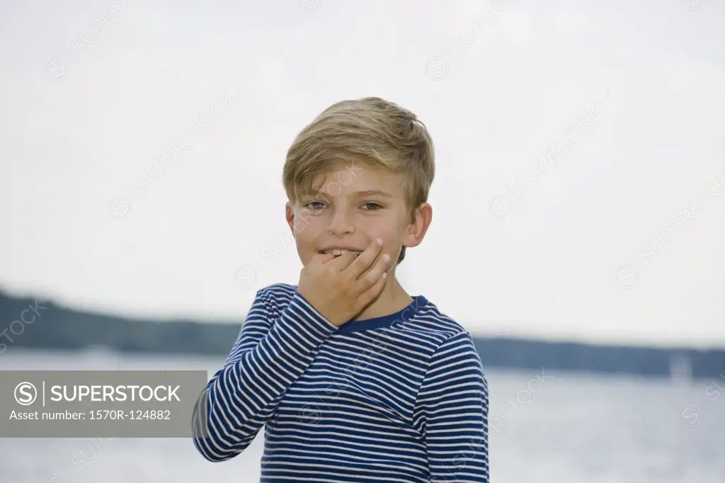 A young boy whistling with his fingers