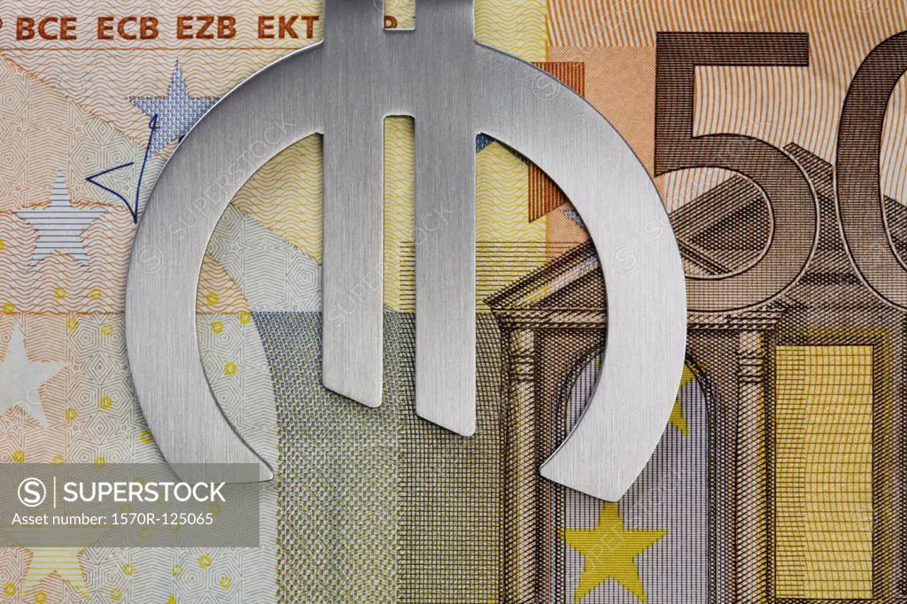 Fifty Euro banknote in a Euro symbol money clip