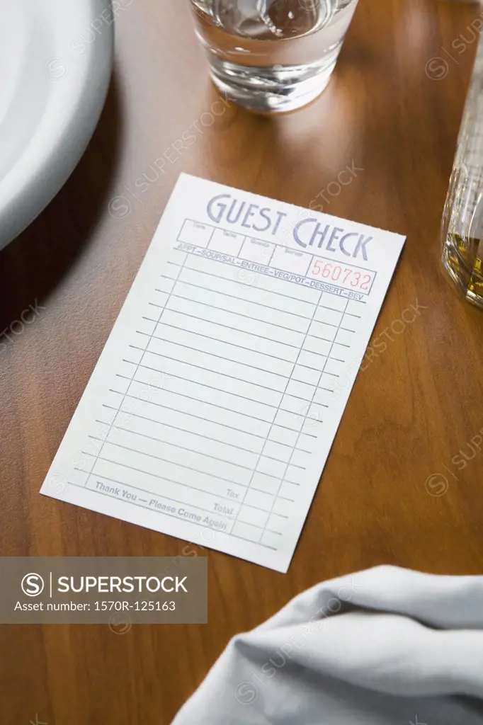 A blank guest check on a table