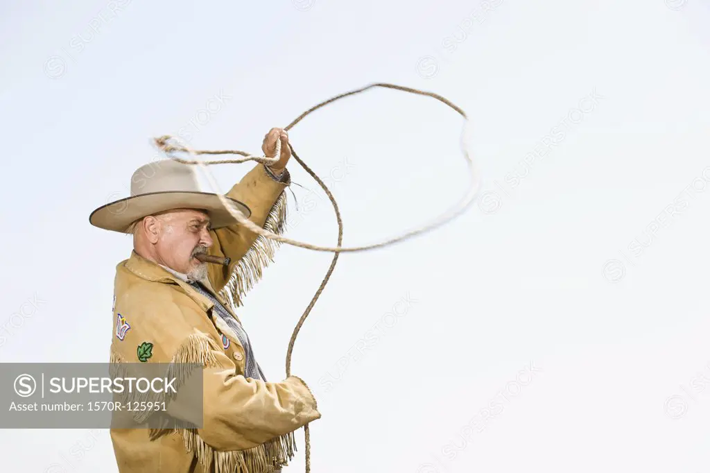A cowboy throwing a lassoo