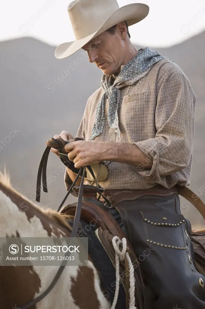 A cowboy sitting on his horse