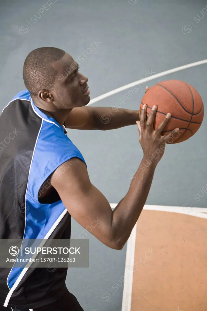 A man preparing to shoot a basketball