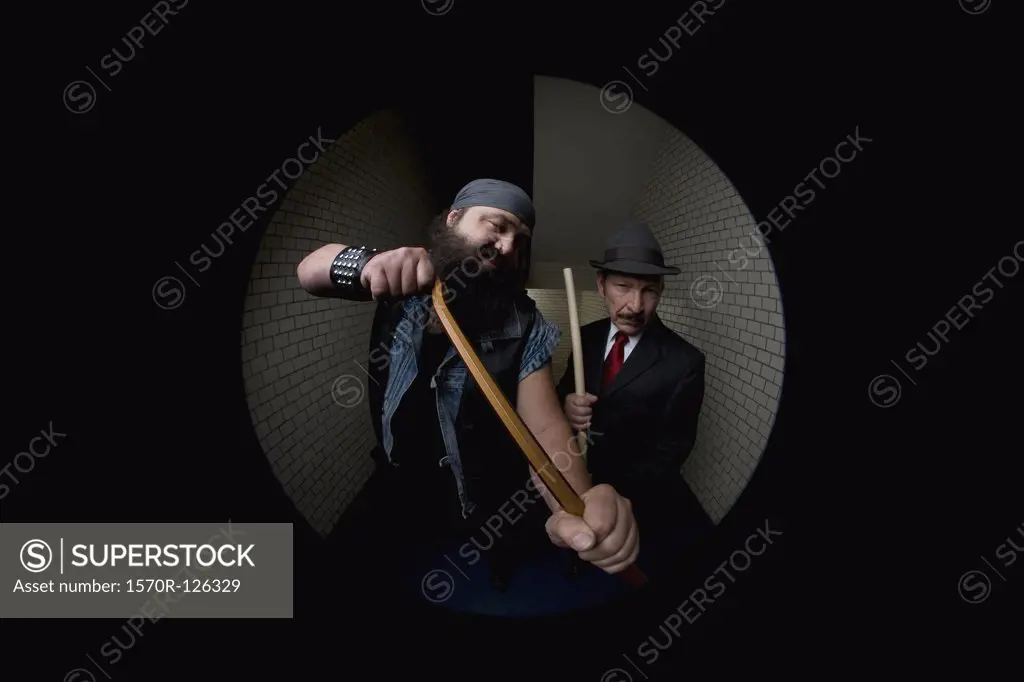 An organized crime boss and his bodyguard, viewed through a peephole