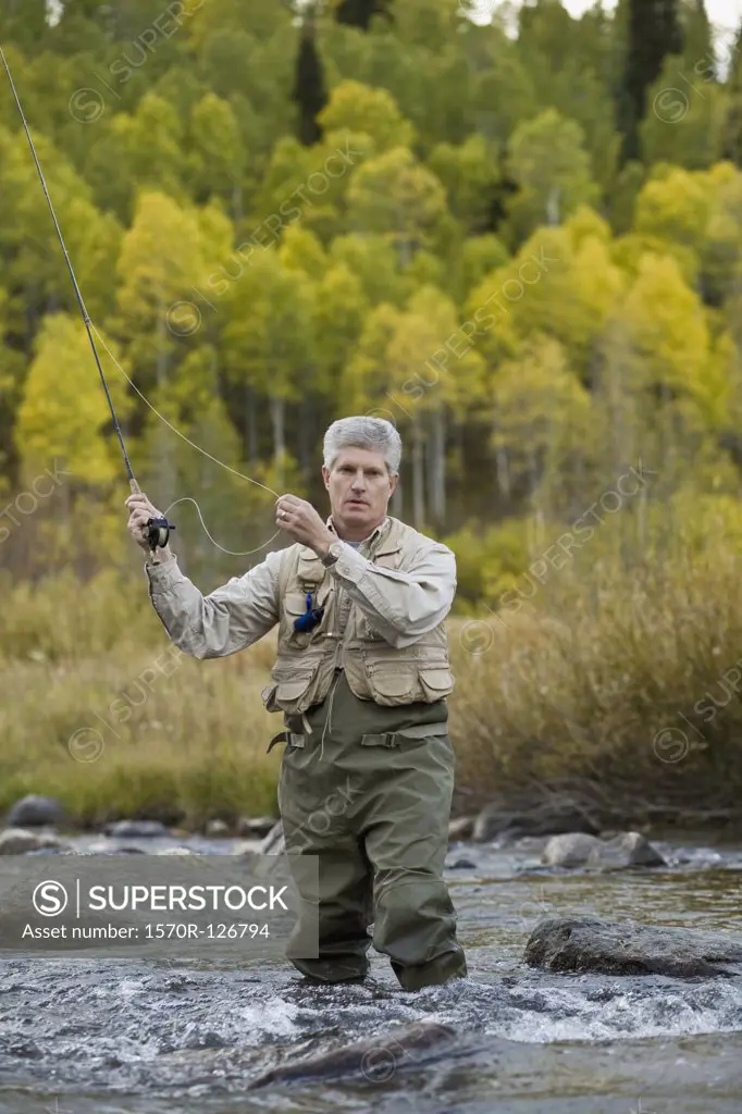 A man fly fishing in a river