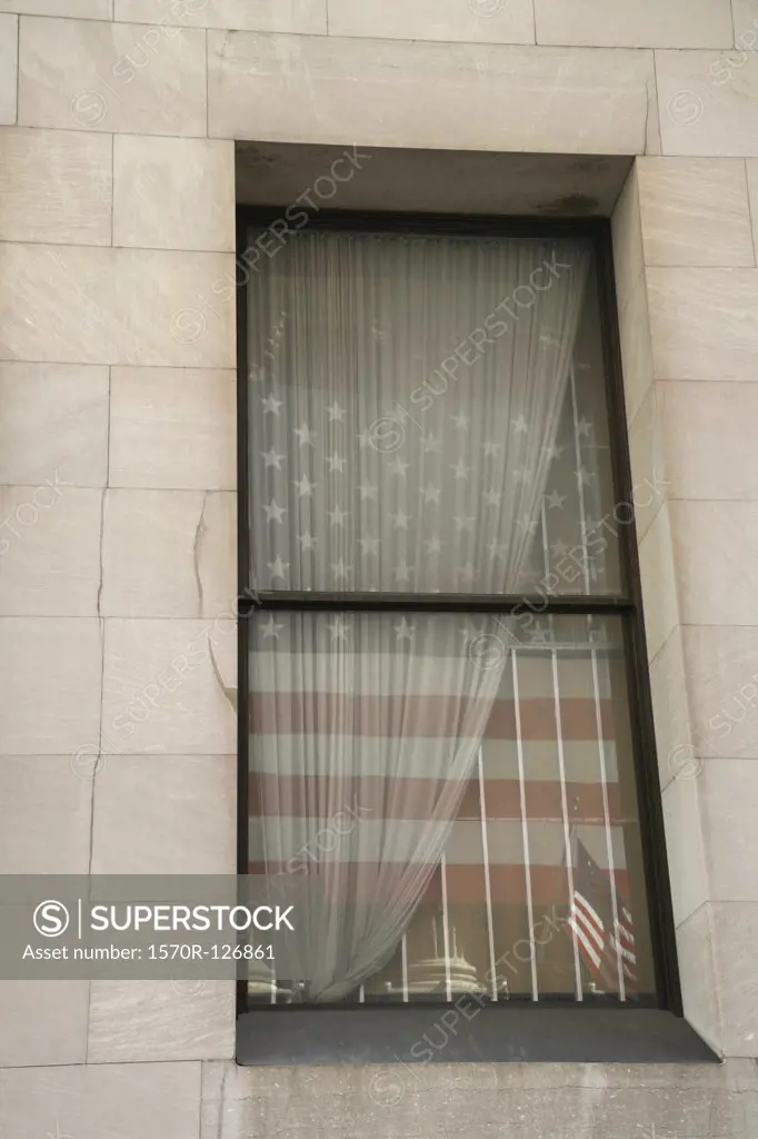 The American flag reflected in a window