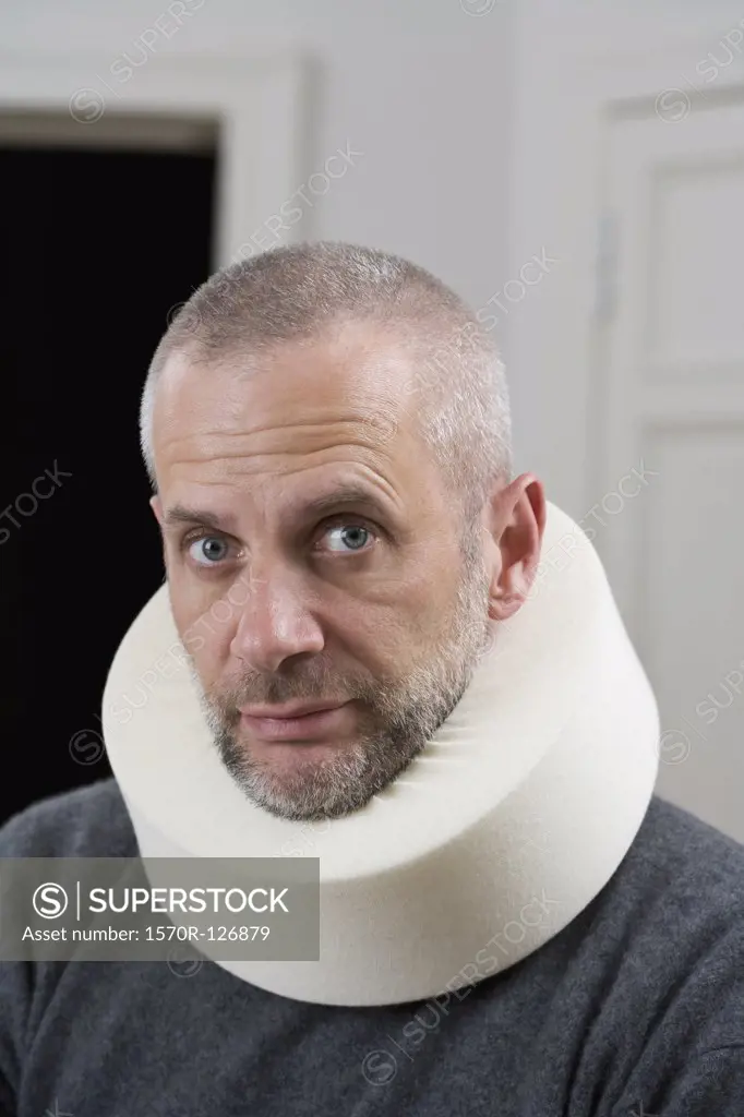 A man wearing a neck brace