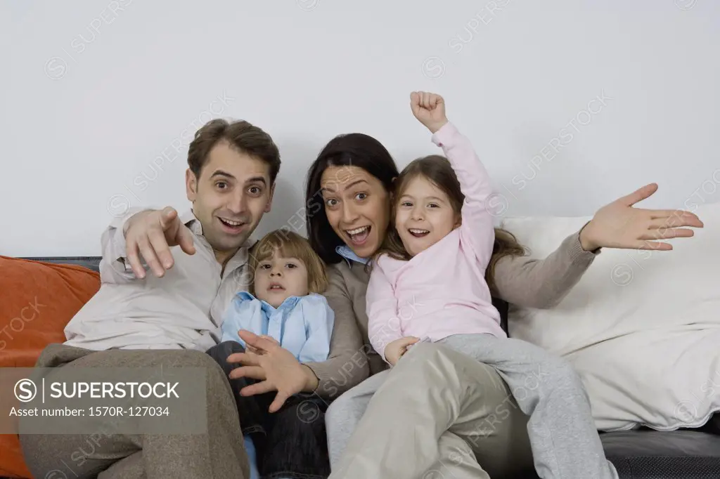 A family of four with excited expressions