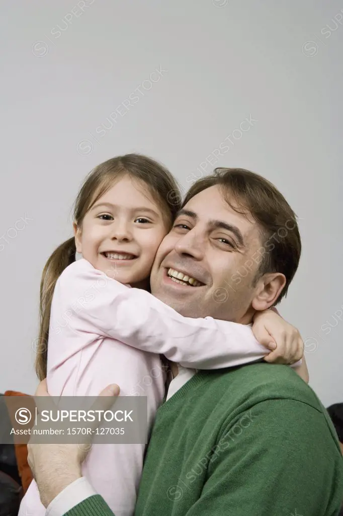 A father embracing his daughter