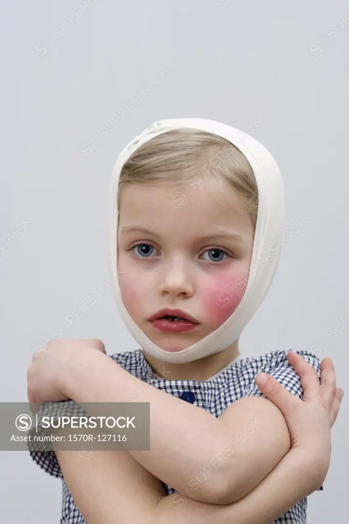 A young girl with a head injury and cheek injury