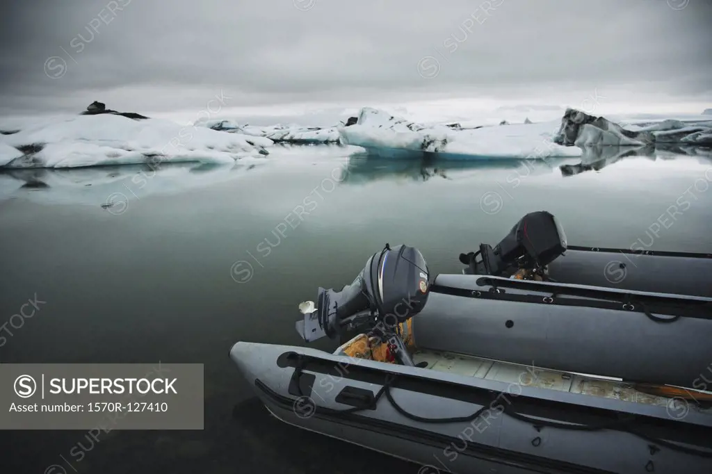 Two outboard motorboats on a glacial lagoon