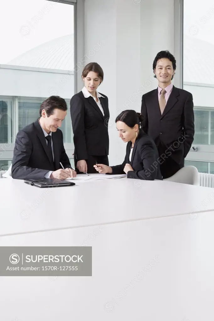 Four business people in a business meeting