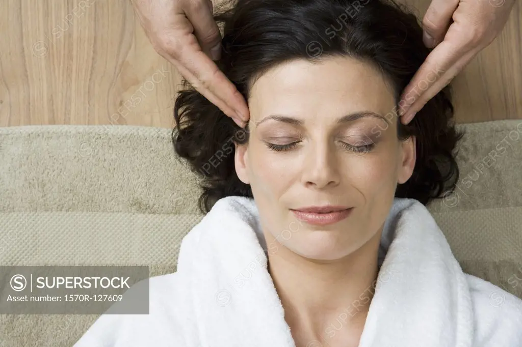 A woman having a head massage