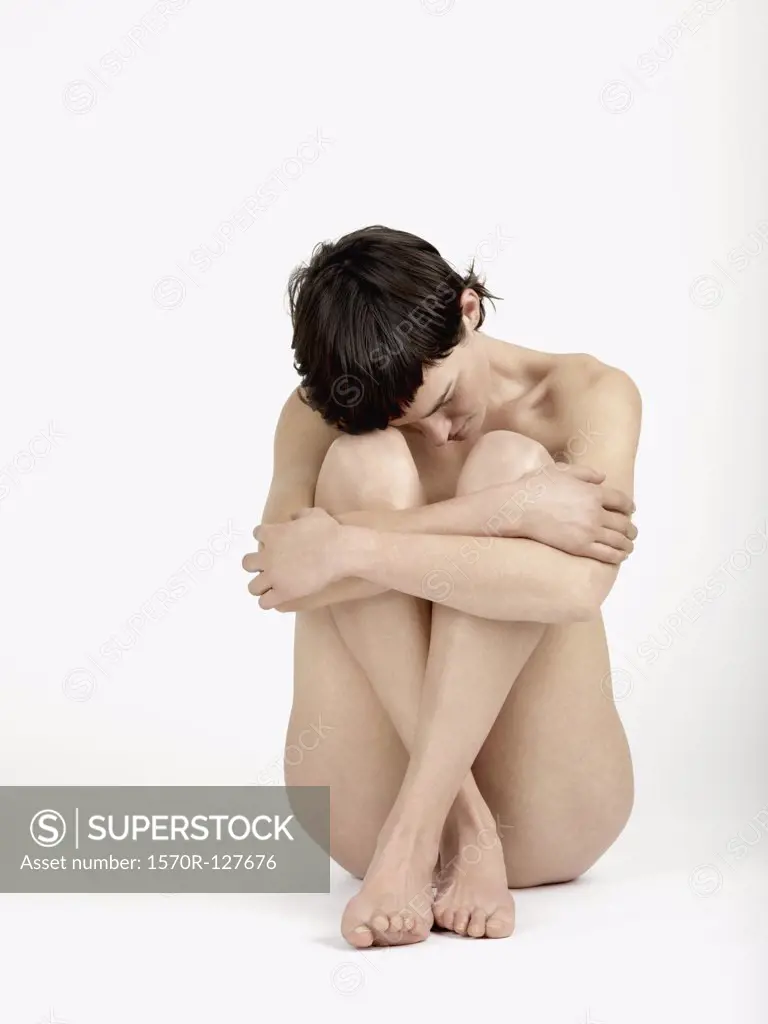 A naked woman sitting