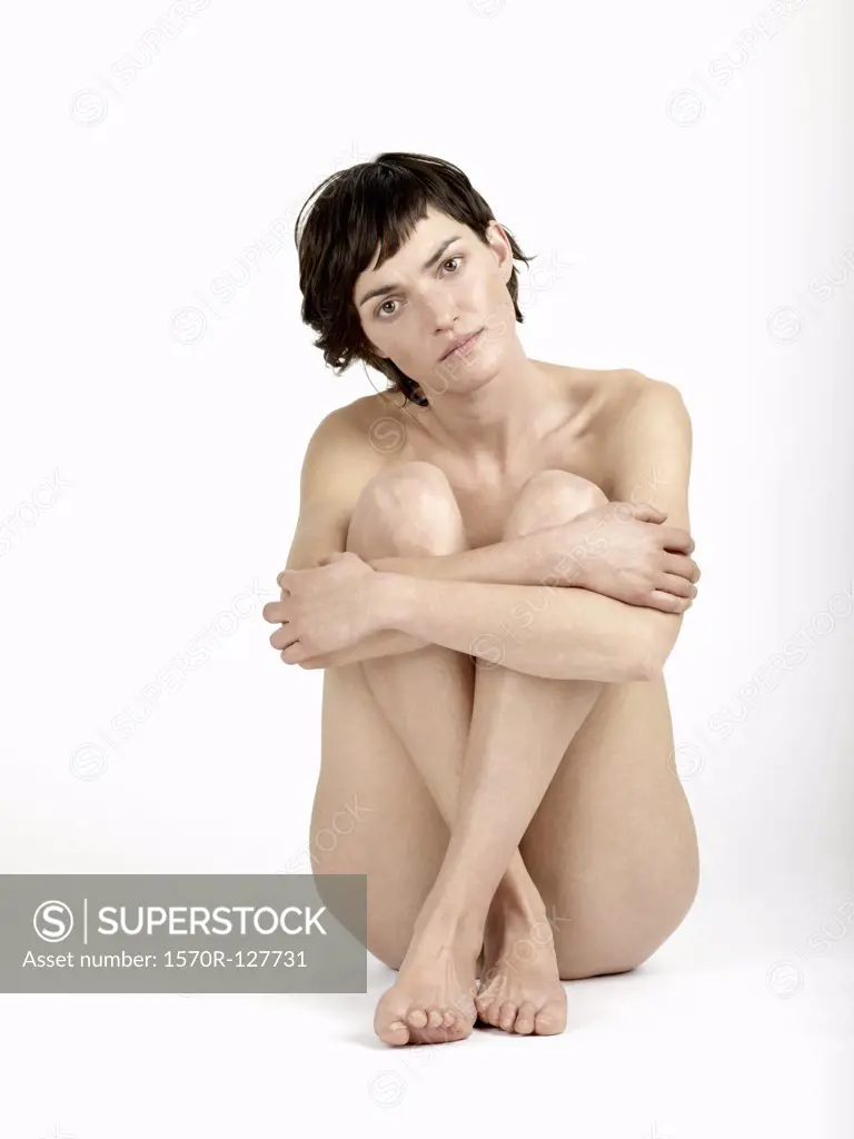 A naked woman sitting