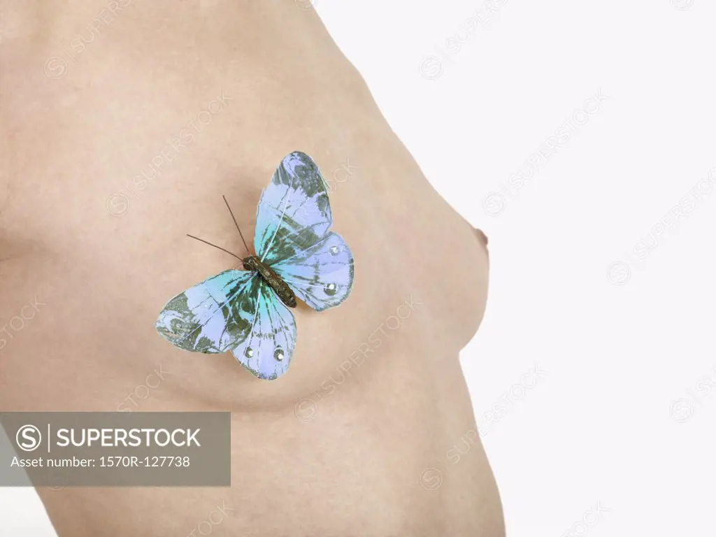 A butterfly on a woman's breast