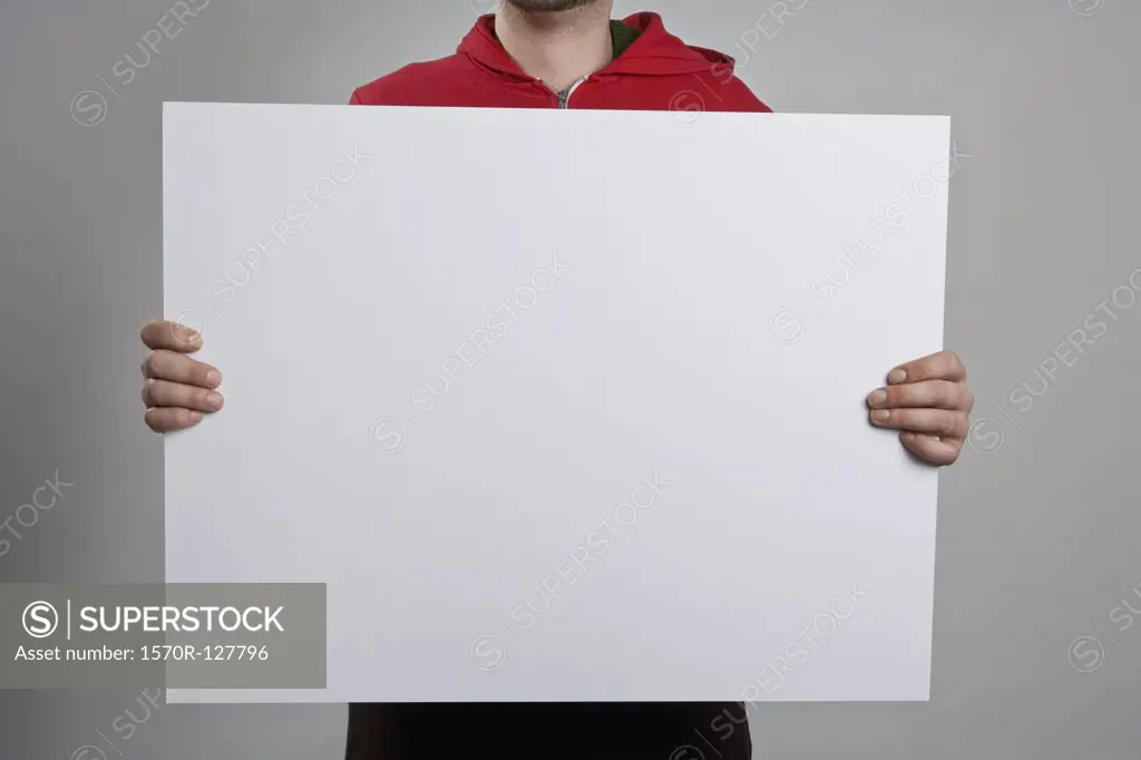 A man holding a blank sign