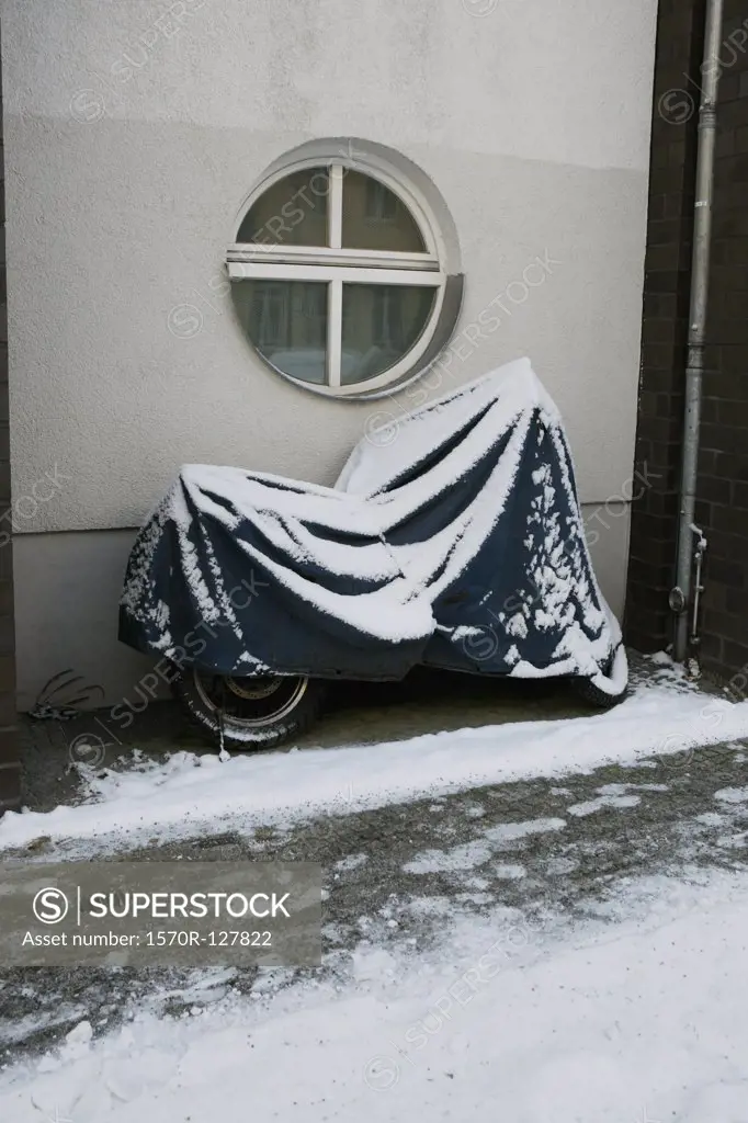 A motorcycle covered in snow