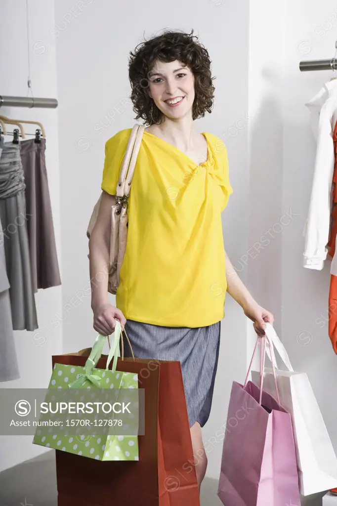 A young woman shopping in a clothing store