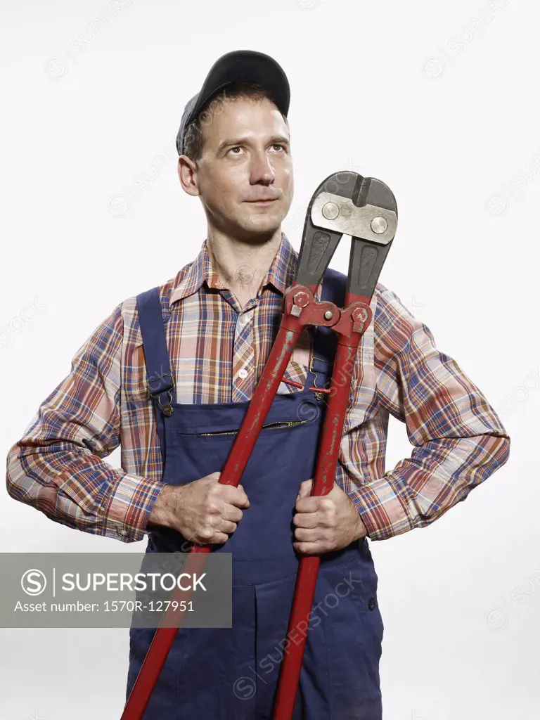 A man holding bolt cutters