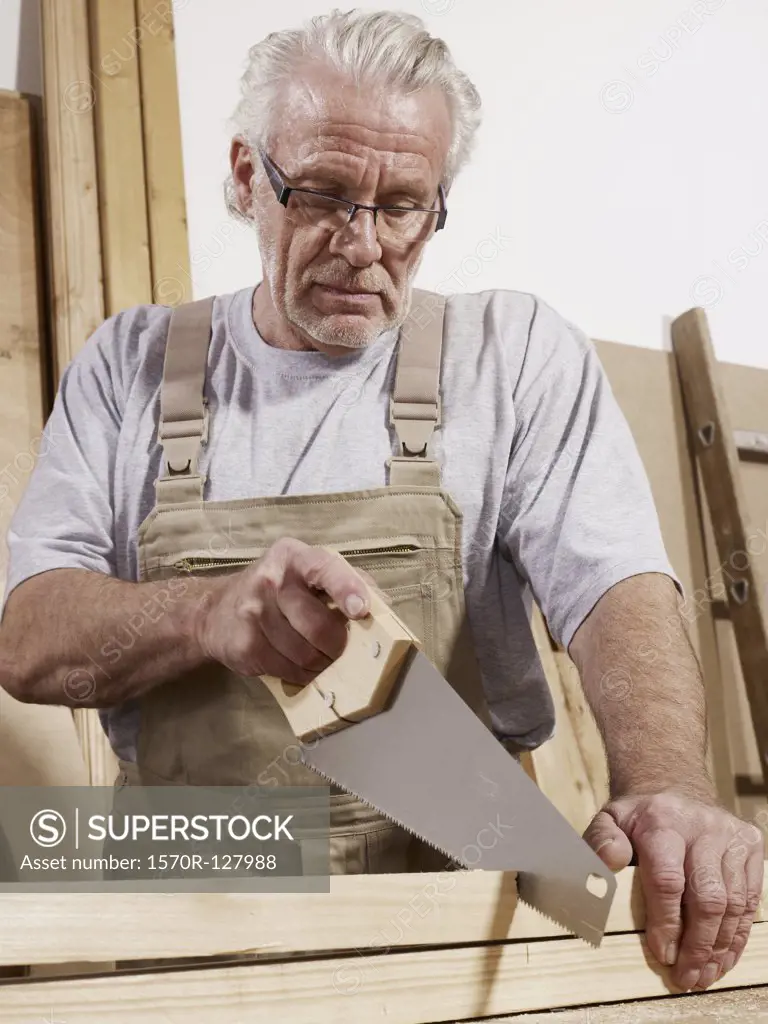 A man sawing wood