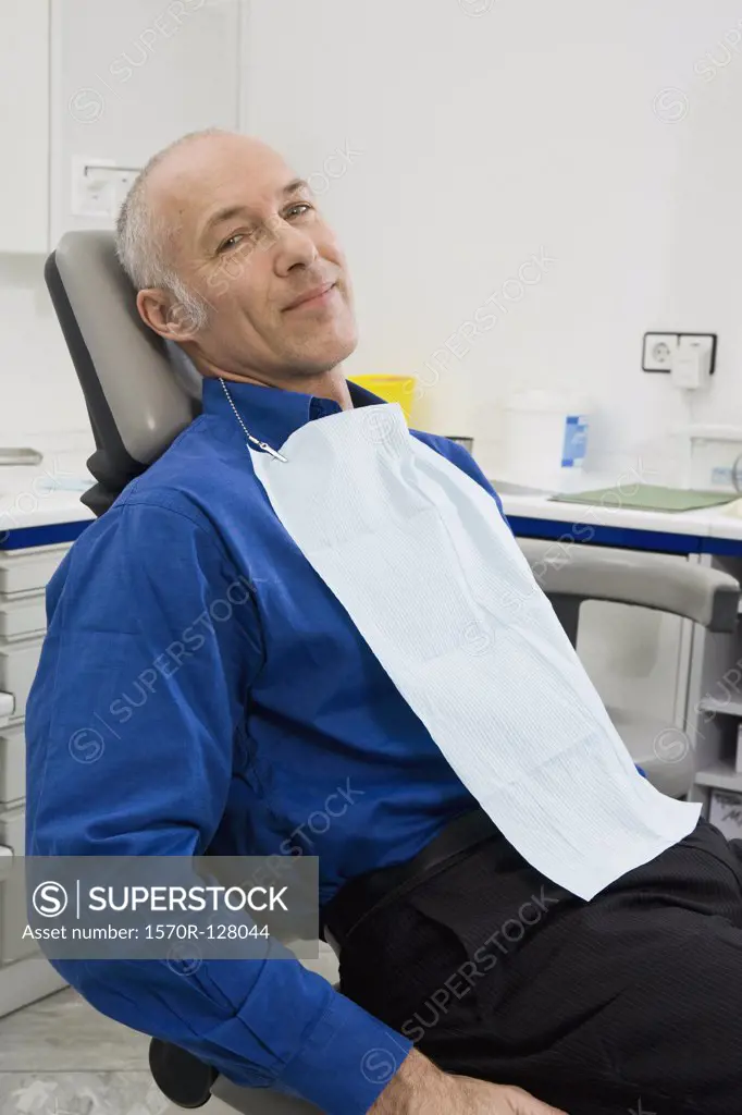 A patient sitting in a dentist's chair