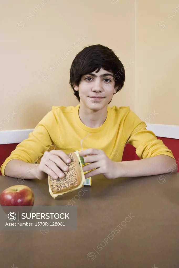 A schoolboy eating lunch