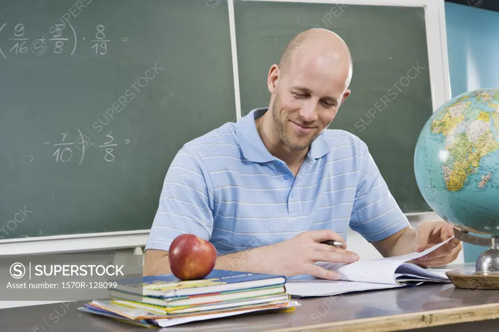 A teacher sitting at a desk