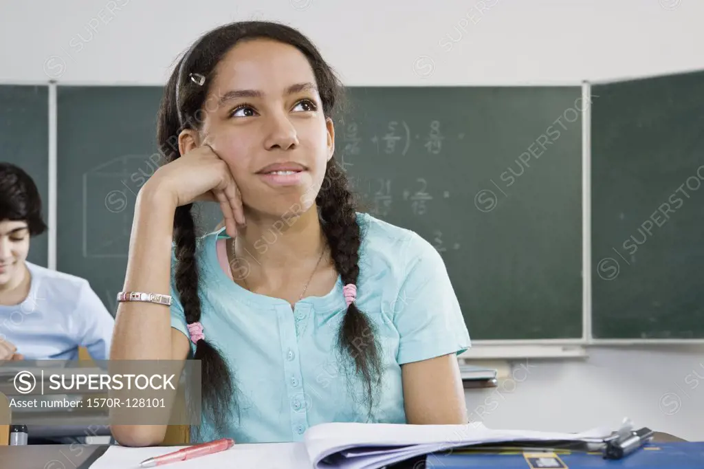 A schoolgirl sitting at a desk