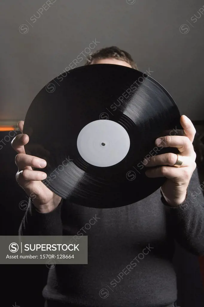 A man holding a record