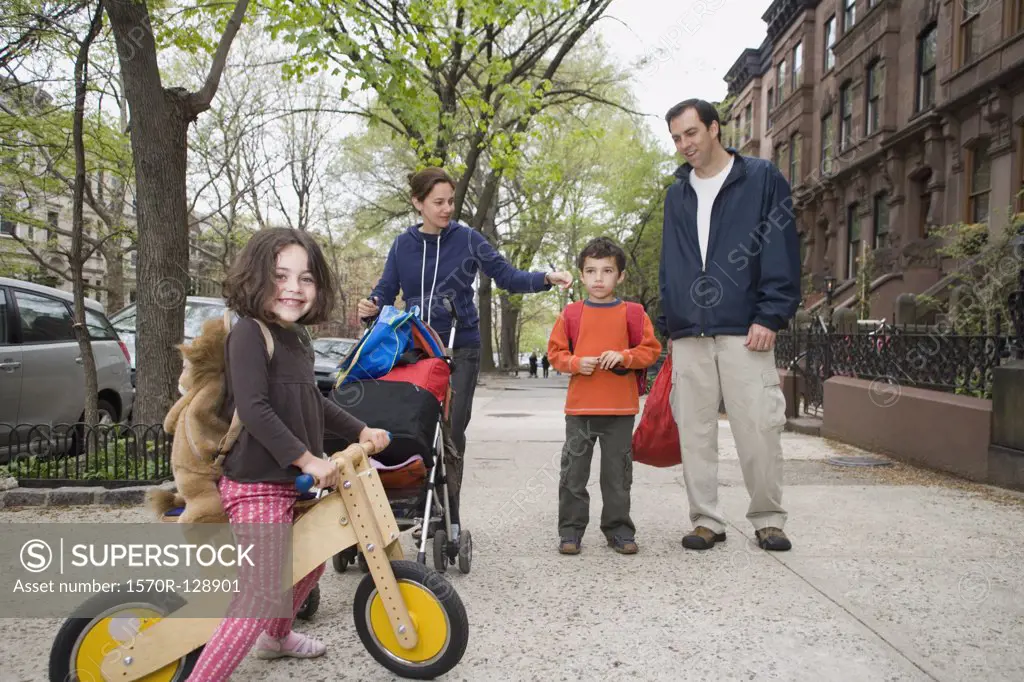 A family on a sidewalk, Brooklyn, New York City
