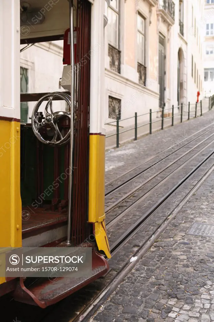 A street car at the bottom of a hill