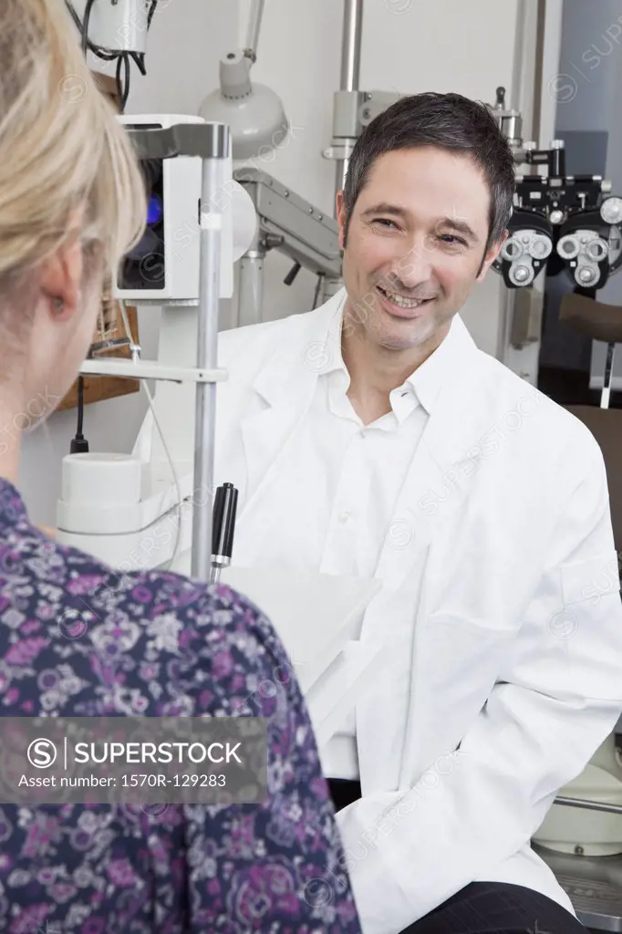 An ophthalmologist doing a slit-lamp biomicroscope exam on a patient