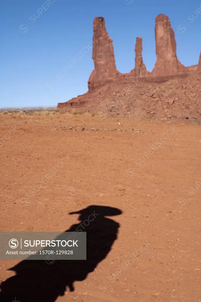 The shadow of a cowboy near Three Sisters
