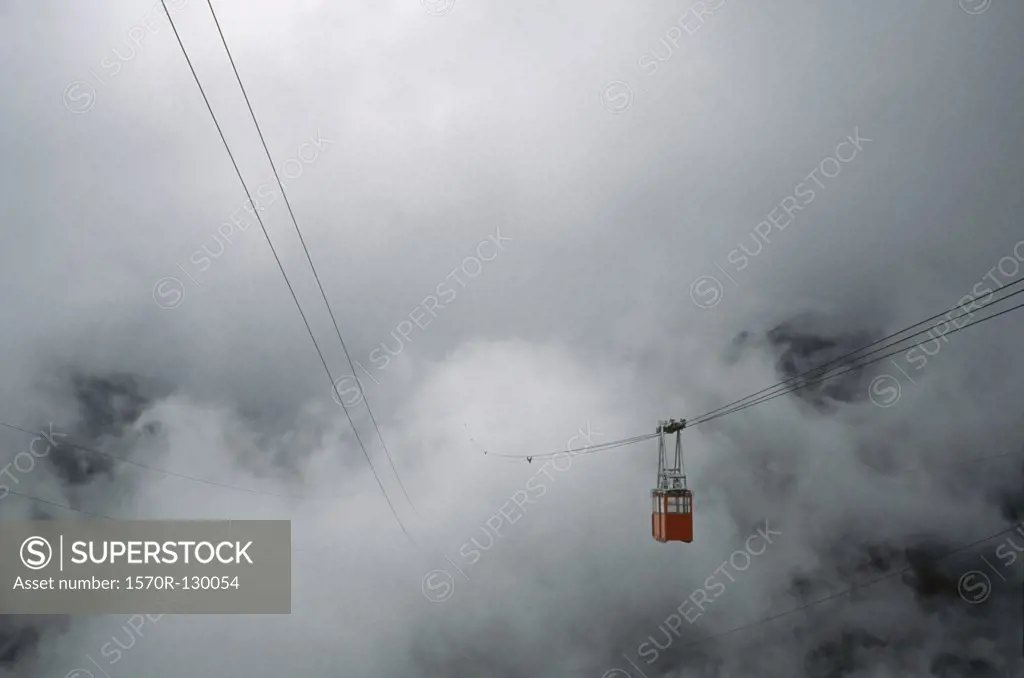 Overhead cable car traveling into mist, Mérida, Venezuela