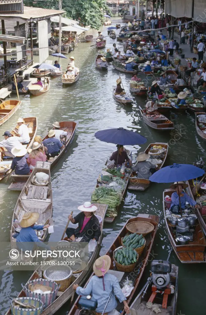 Market vendors at Floating Market, near Bangkok, Thailand