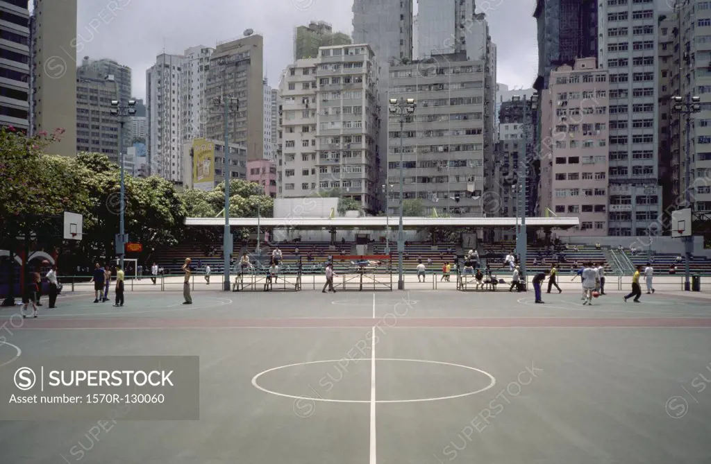 Basketball courts with city buildings in background, Hong Kong, China