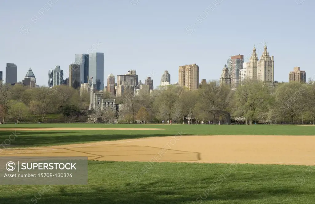 View of the New York City skyline from the Great Lawn in Central Park, New York City, USA