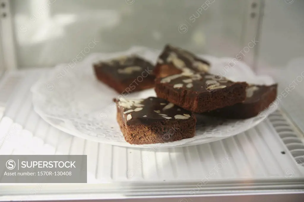 Plate of brownies in refrigerator