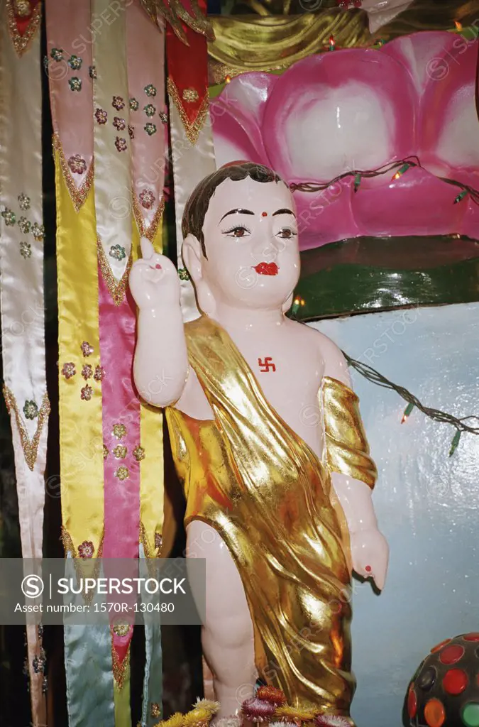 Statue of young Buddha in temple, Saigon, Ho Chi Minh City, Vietnam