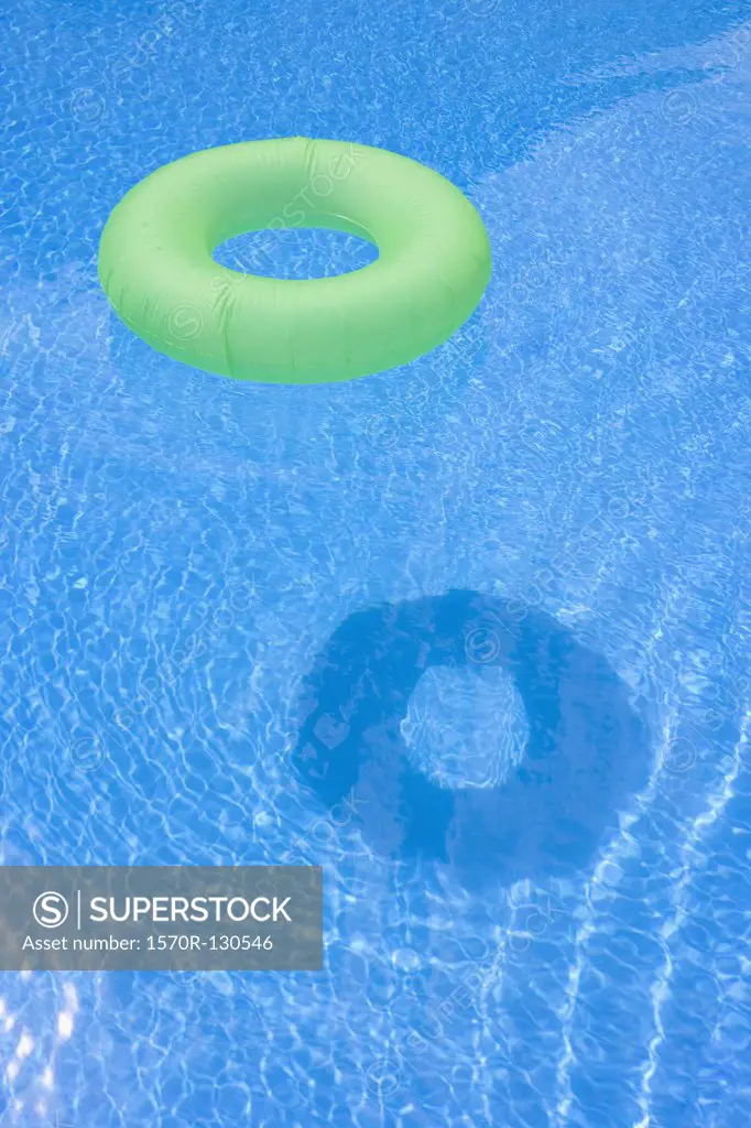 An inflatable ring floating in a swimming pool