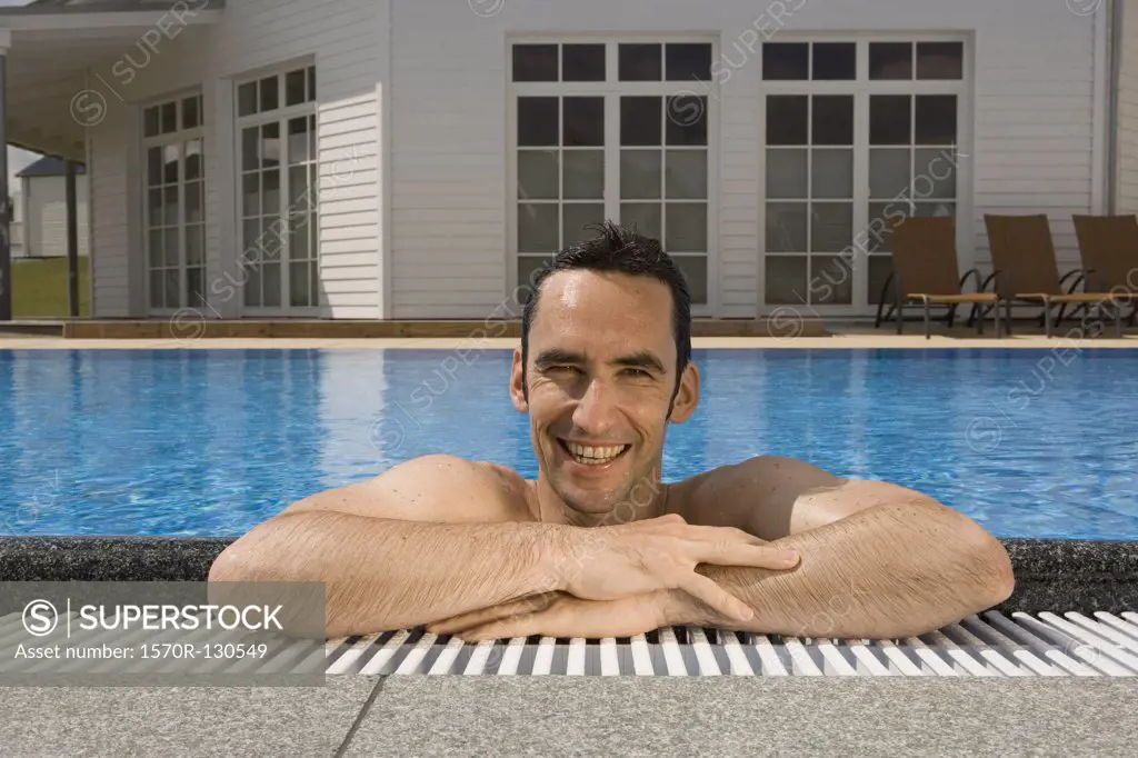 A man relaxing in a swimming pool