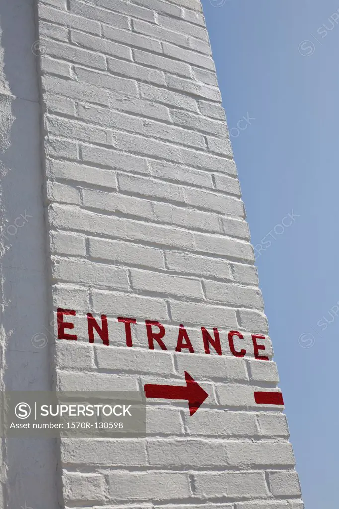 Painted entrance sign and arrow