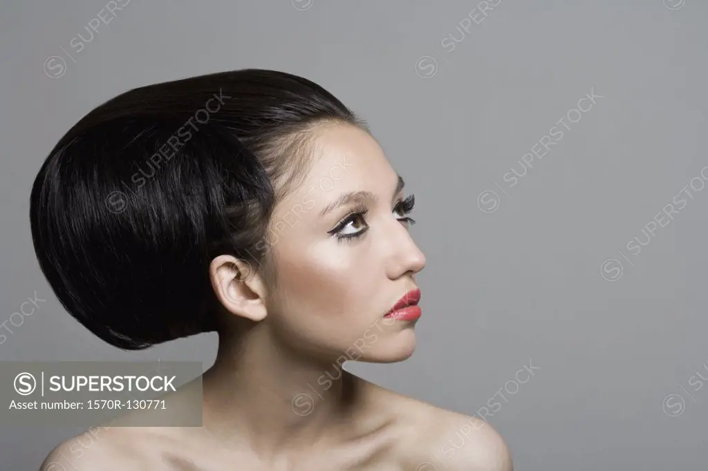 Side view of a teenage girl with a beehive hairstyle