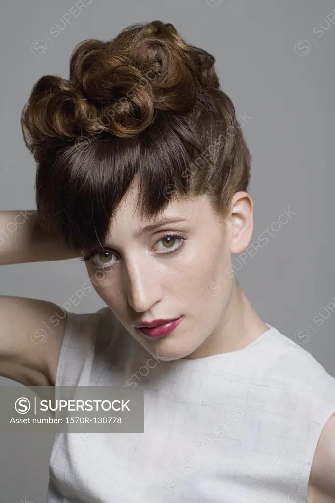 Portrait of a young woman with an elegant hairstyle