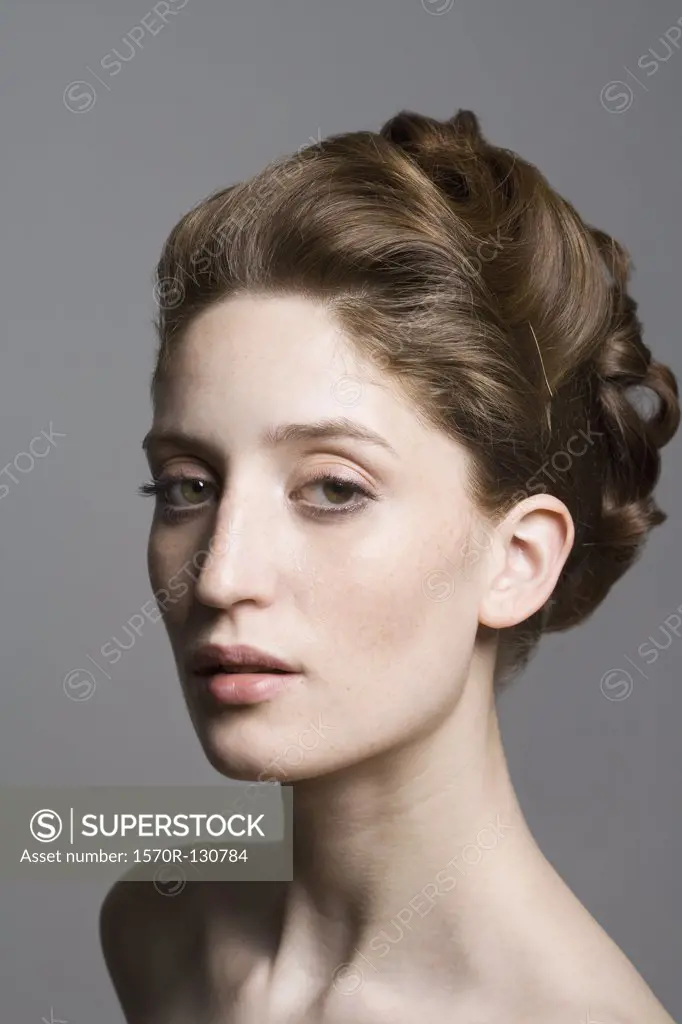 Portrait of a young woman with an elegant hairstyle